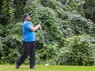 attendees playing golf