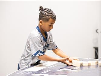 child sorting out table 