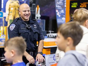 sheriff speaking to guest