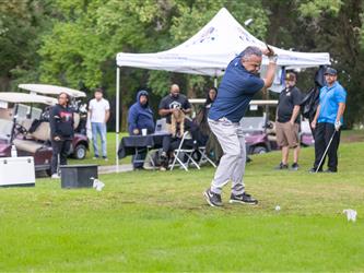 attendees playing golf