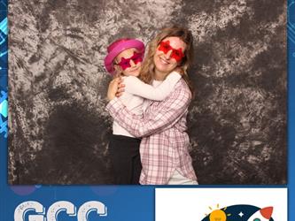 mother and daughter posing for photo booth