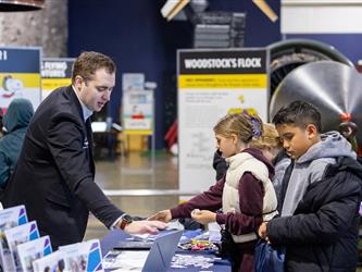 career fair attendees interacting with vendor