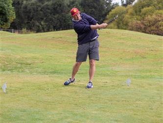 golf player swinging club