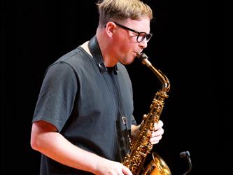 student playing saxophone