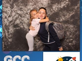 mother and daughter posing for photo booth