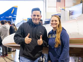 guests posing at entrance