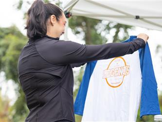 woman inspecting shirt