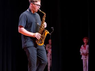 student playing saxophone