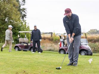 attendee at golf tournament