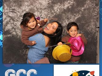 family posing for photobooth