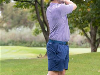 golf player swinging club