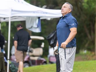 attendees playing golf