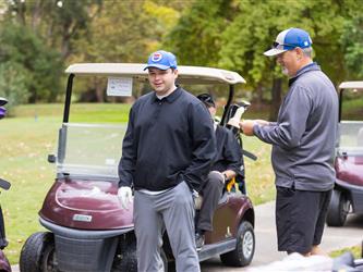 players driving golf carts