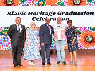 student posing with GCC admin