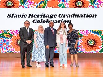 recipient posing with gcc staff on stage