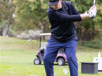 golf player swinging club