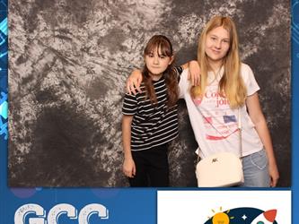 two girls posing for photobooth