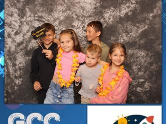 family posing for photobooth