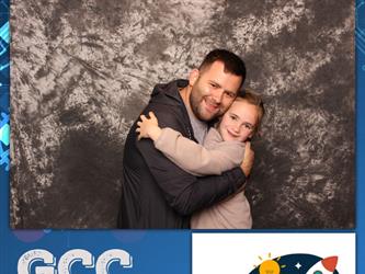 father and daughter posing for photo booth