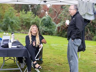 attendees at golf tournament sipping coffee