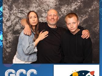 family posing for photobooth