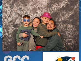 family posing for photobooth
