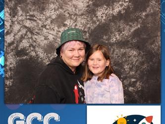 two people posing for photo booth