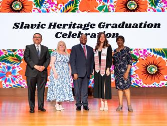 recipient posing with gcc staff on stage