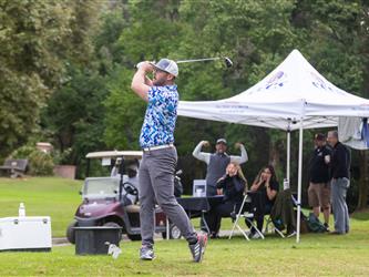 attendees playing golf