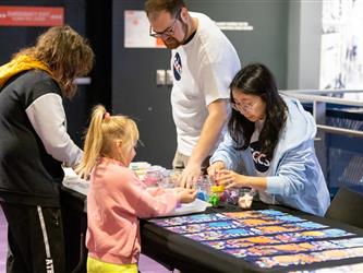 guests interacting with welcome display 
