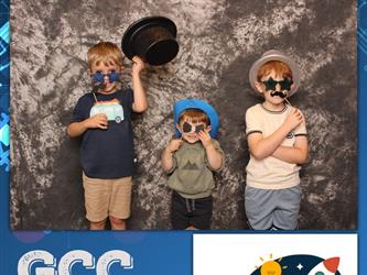 children posing for photo booth 