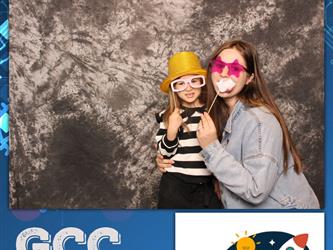 daughter and mom posing with props 