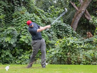 golf player swinging club