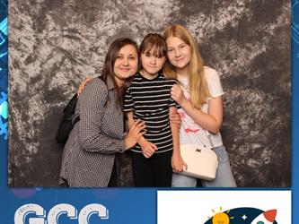 family posing for photobooth