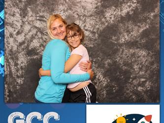 mother and daughter posing for photo booth