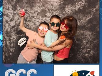 family posing for photobooth