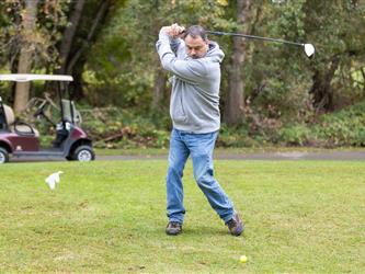 golf player swinging club