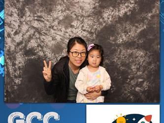 mother posing with daughter with peace sign 