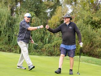 golf attendees celebrating