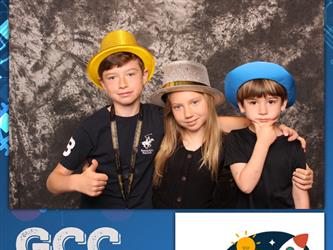 family posing for photobooth