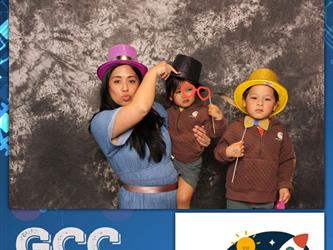 family posing for photobooth