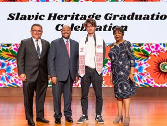 student posing with GCC admin