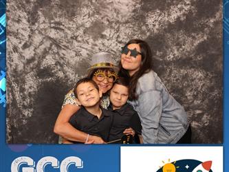 family posing for photobooth