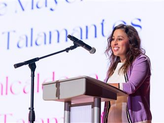 speaker on stage at podium