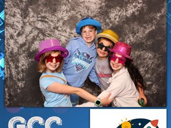 family posing for photobooth