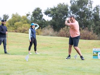 golf player swinging club
