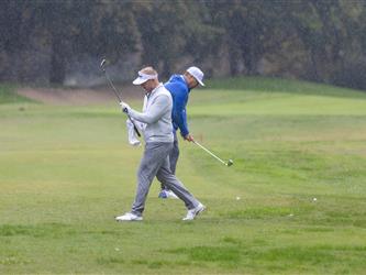 attendees playing golf