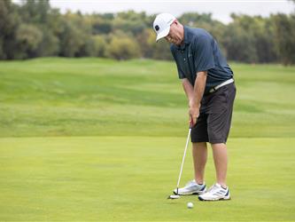 golf player preparing to swing