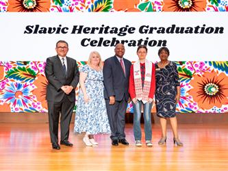 recipient posing with gcc staff on stage