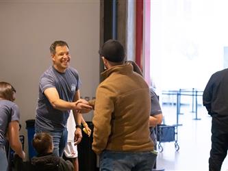 staff shaking hands with guest